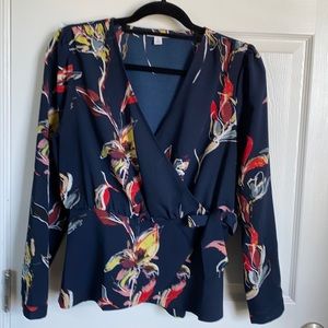 Bar 111 brand women wrap around long sleeve blouse. Navy blue with red flowers